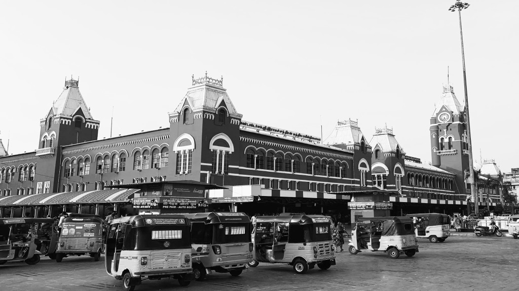 Chennai Central station building with auto-rickshaws in front